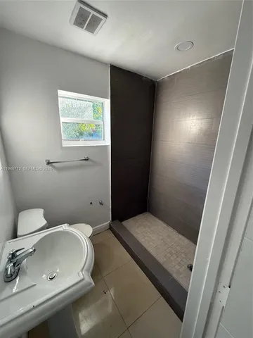 a bathroom with a toilet and a sink