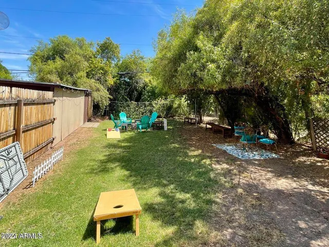 a backyard of a house with seating space