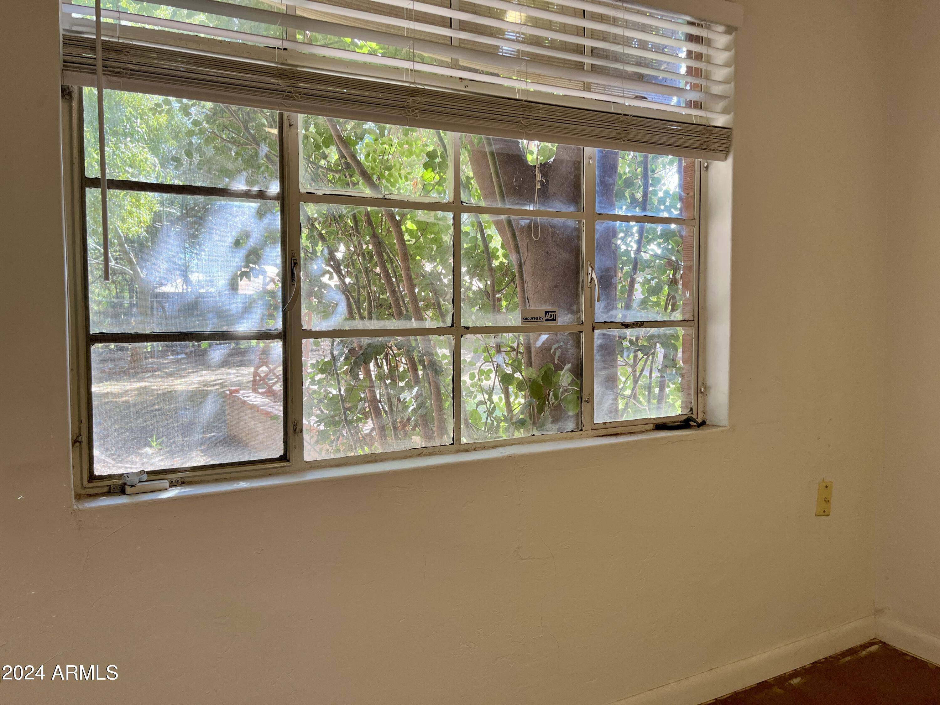 15 East Oregon Avenue, Unit 15 Phoenix, AZ 85012 - Photo 14 of 14 a window with an outdoor space