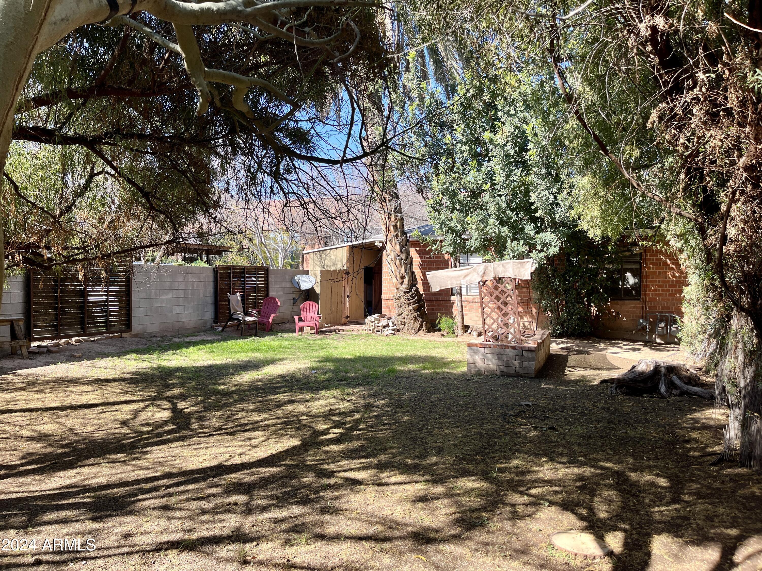 15 East Oregon Avenue, Unit 15 Phoenix, AZ 85012 - Photo 9 of 14 a view of a house with a yard
