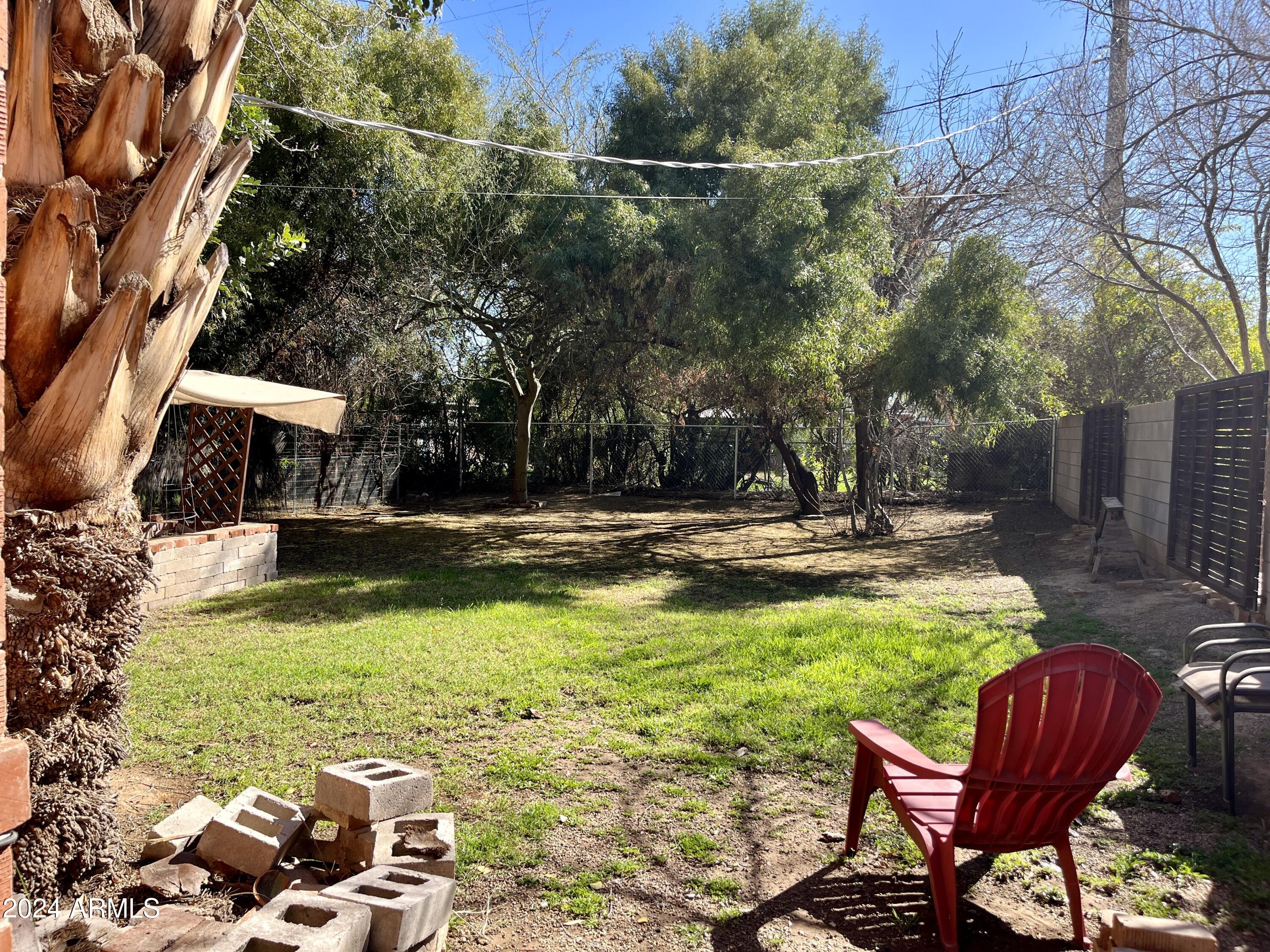15 East Oregon Avenue, Unit 15 Phoenix, AZ 85012 - Photo 10 of 14 a view of swimming pool with lawn chairs and plants