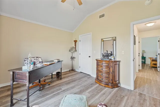 a room with furniture and a wooden floor