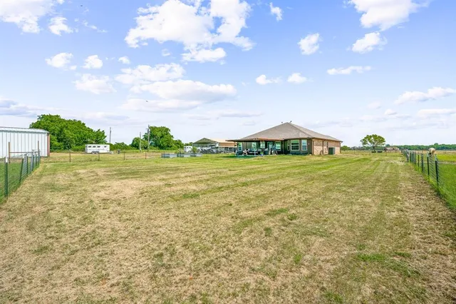 a view of a lake with a big yard