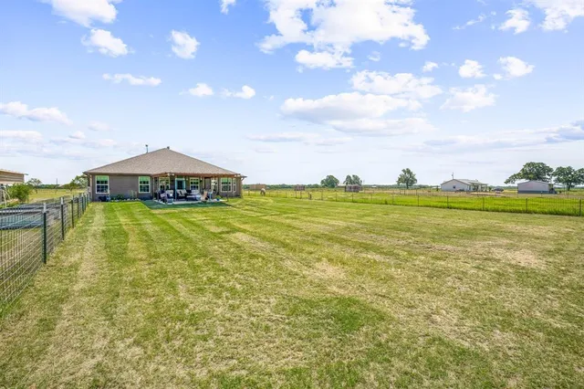 a view of a lake with a big yard