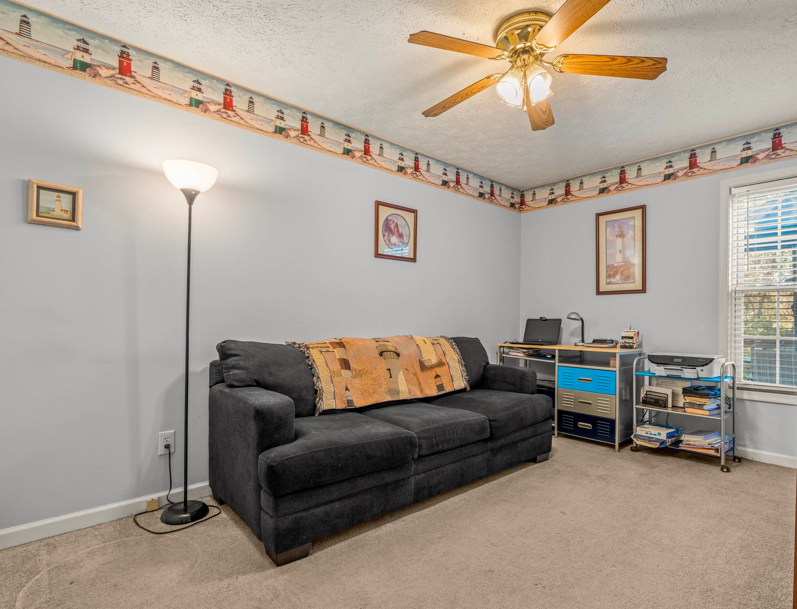 1046 Bridge Avenue Waynesboro, VA 22980 - Photo 13 of 23 a living room with furniture a ceiling fan and a window