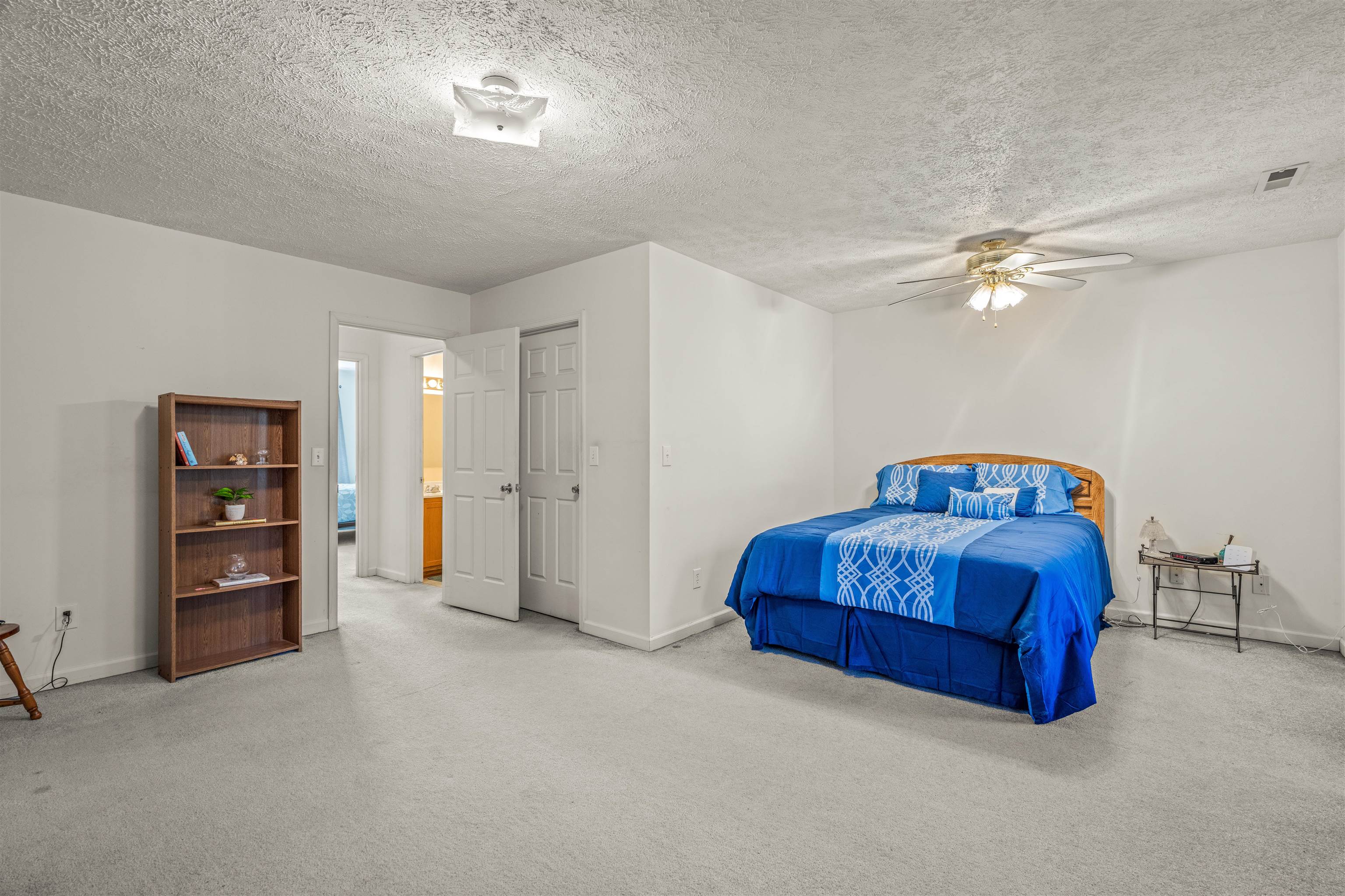 1046 Bridge Avenue Waynesboro, VA 22980 - Photo 15 of 23 a living room with a bed and a ceiling fan