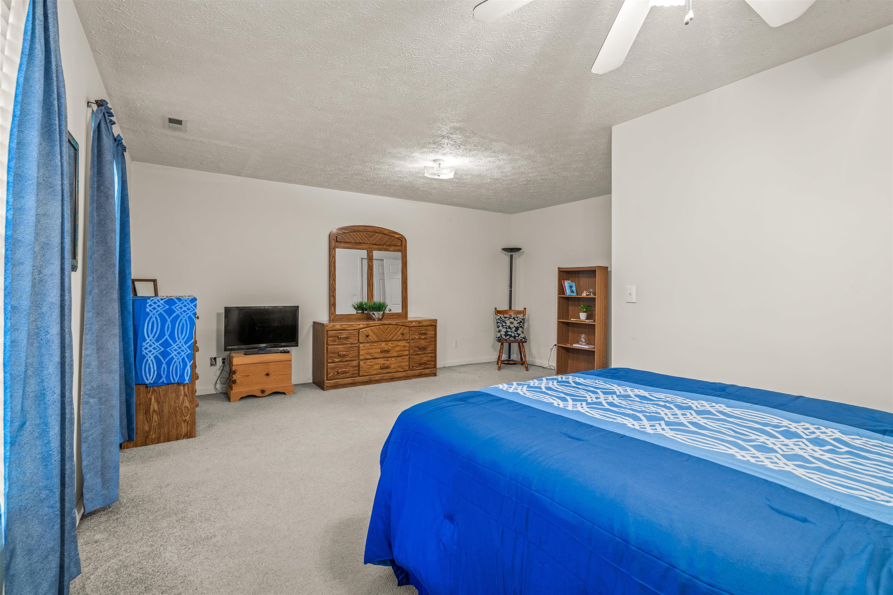 1046 Bridge Avenue Waynesboro, VA 22980 - Photo 17 of 23 a spacious bedroom with a bed and a television in it