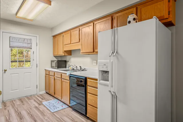 a kitchen with stainless steel appliances a refrigerator and a stove