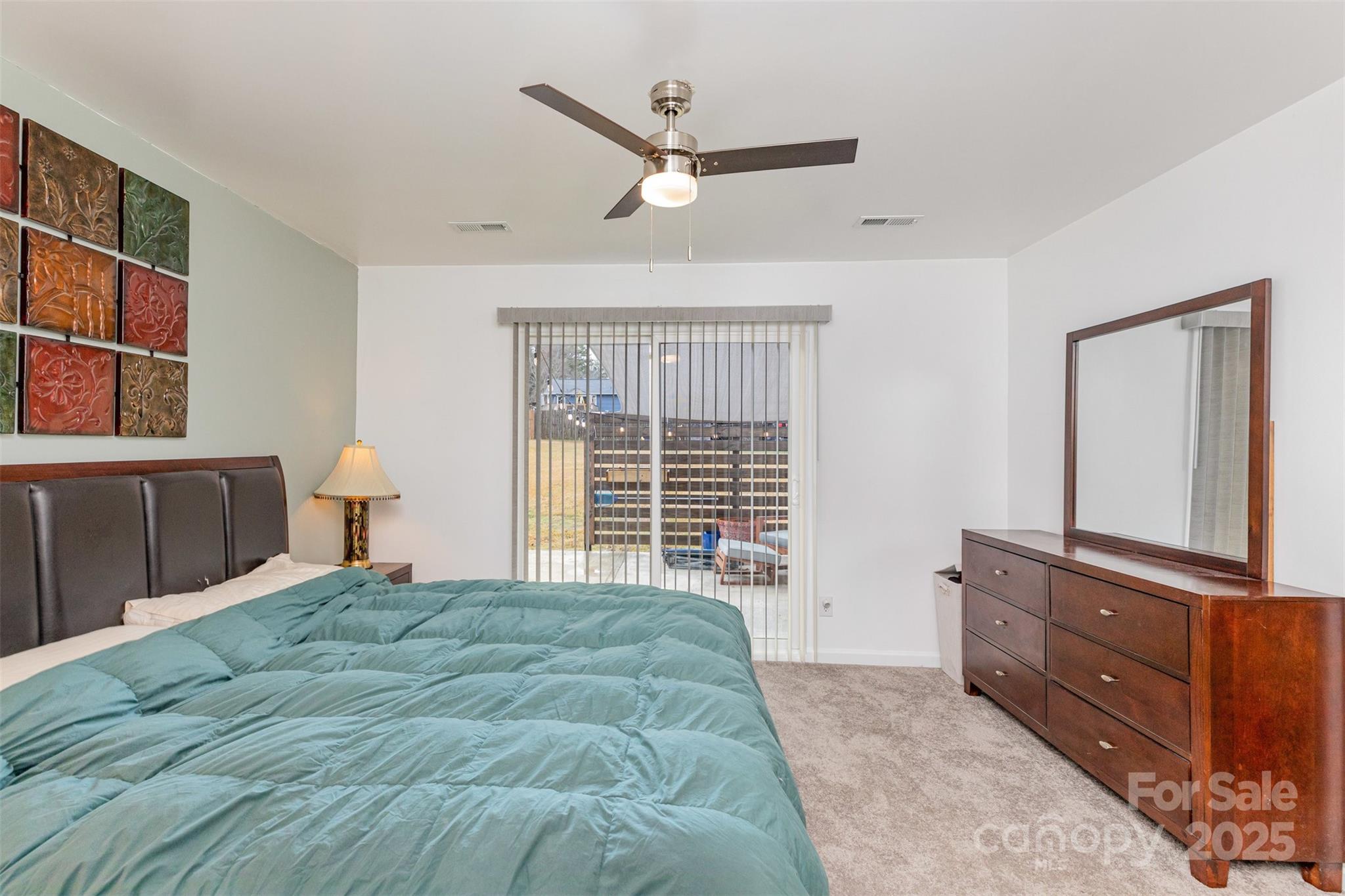 2241 Indian Cross Trail Matthews, NC 28104 - Photo 11 of 46 a bedroom with a large bed and a window