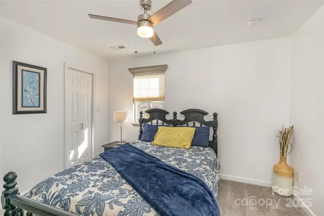 a bedroom with a bed and furniture