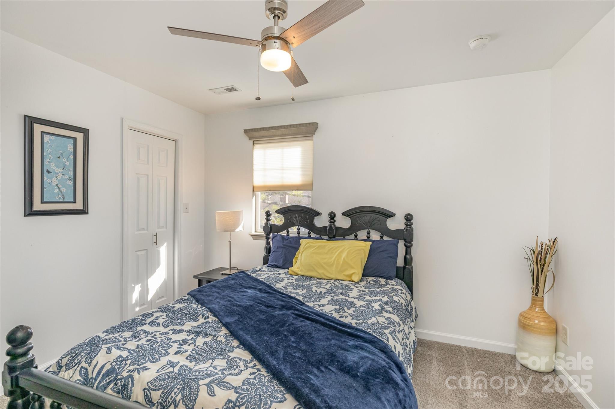 2241 Indian Cross Trail Matthews, NC 28104 - Photo 32 of 46 a bedroom with a bed and wooden floor