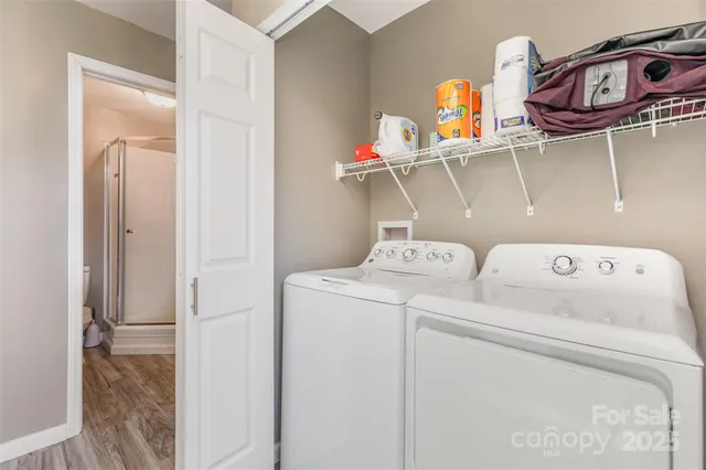 a dining room with furniture and a floor to ceiling window