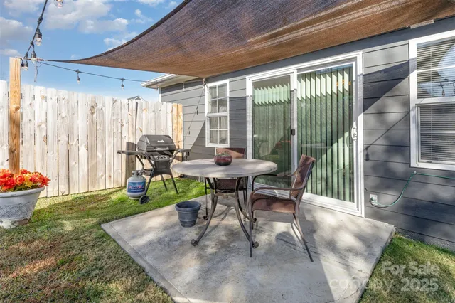 a view of a chair and table in the patio