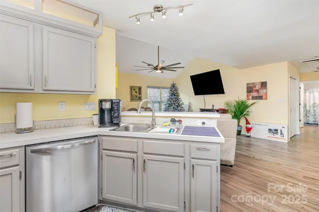 a kitchen with a sink and cabinets