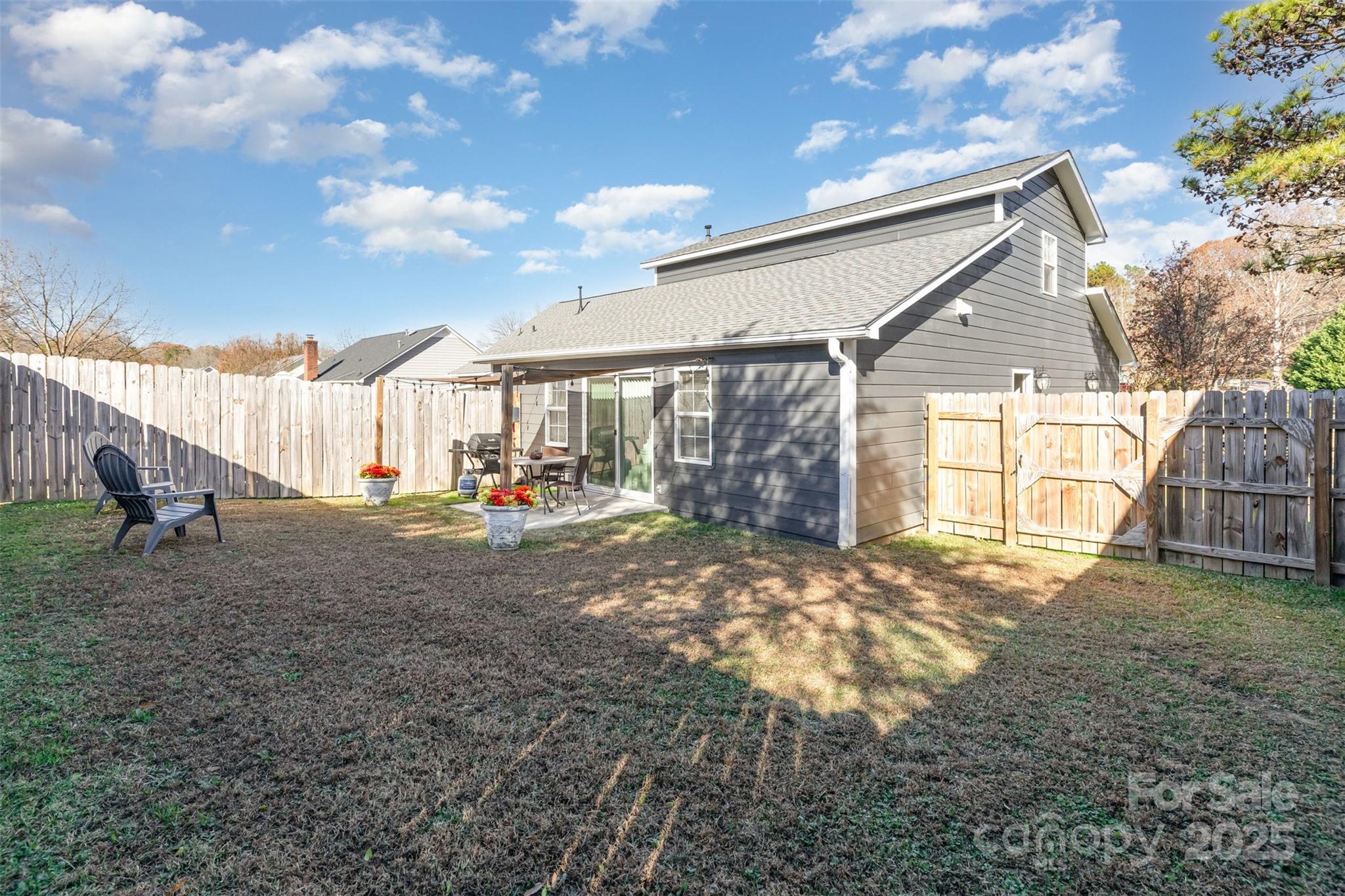 2241 Indian Cross Trail Matthews, NC 28104 - Photo 42 of 46 a view of a house with backyard and a tree