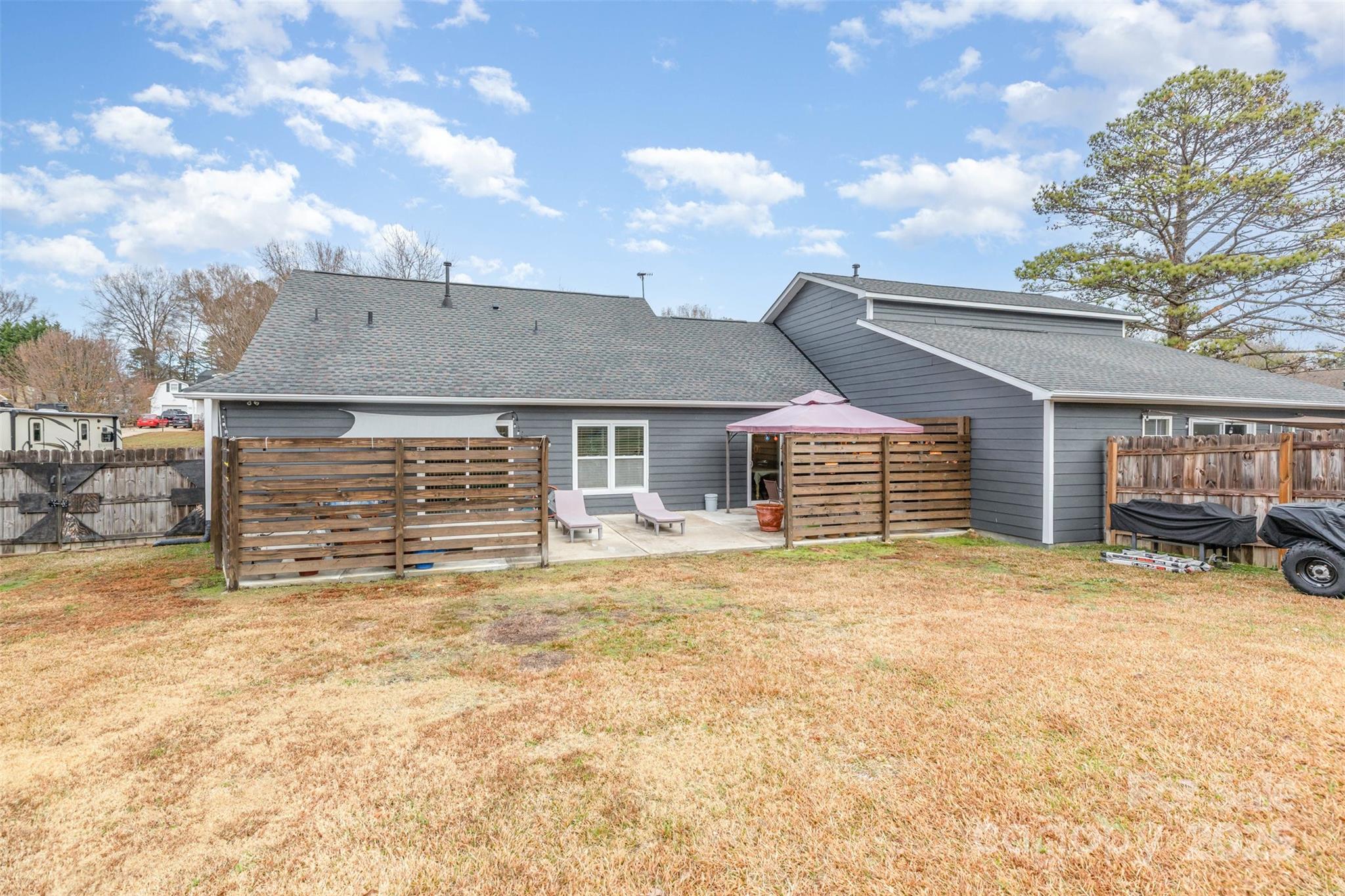 2241 Indian Cross Trail Matthews, NC 28104 - Photo 43 of 46 a view of a house with a yard and garage