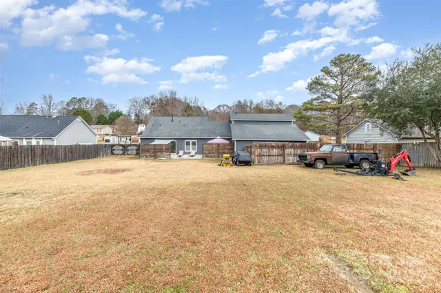 an aerial view of a house with outdoor space lake view