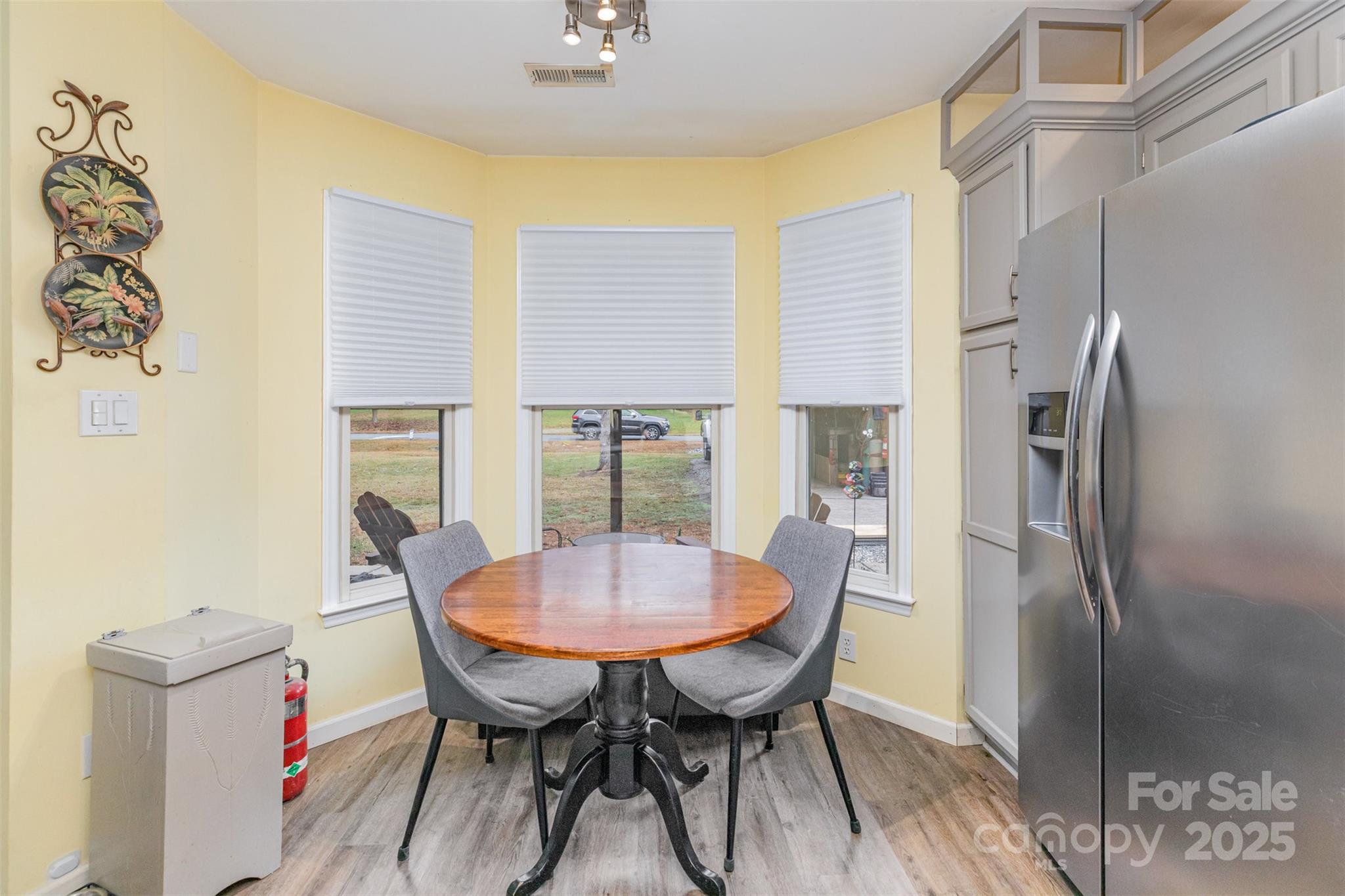2241 Indian Cross Trail Matthews, NC 28104 - Photo 5 of 46 a view of a dining room with furniture window and wooden floor