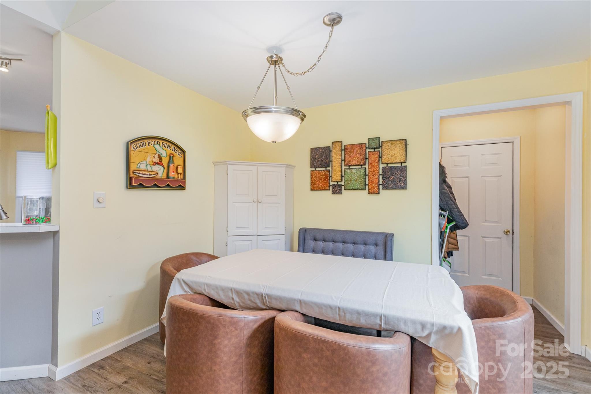 2241 Indian Cross Trail Matthews, NC 28104 - Photo 9 of 46 a bedroom with a bed and a chandelier