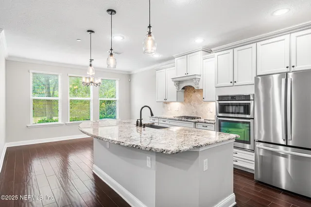 a front view of a house with swimming pool and sitting area