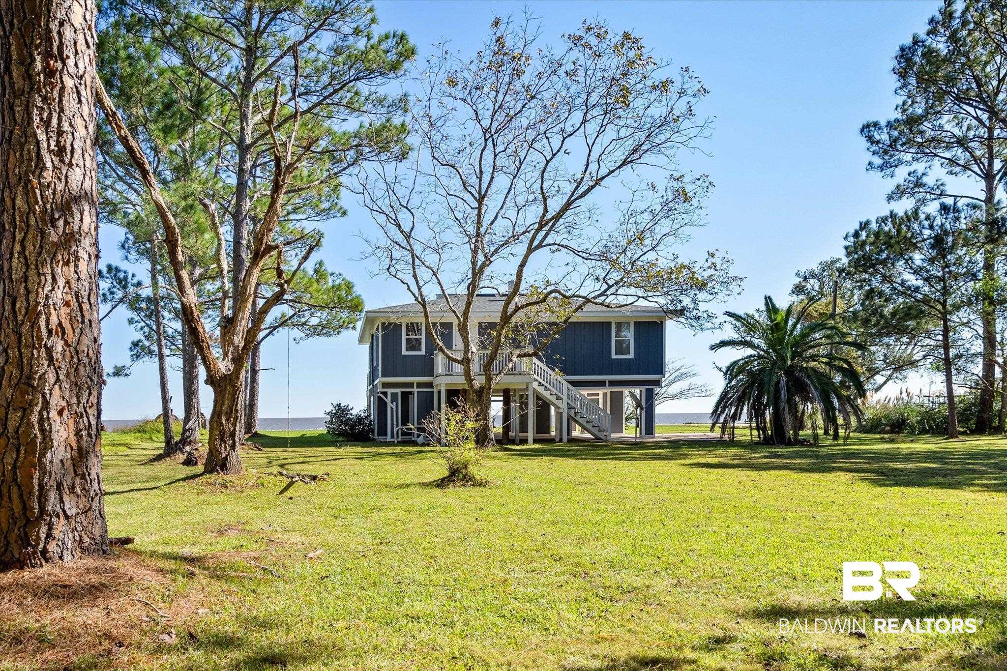 15111 Regus Road Coden, AL 36523 - Photo 20 of 35 Beach home with a front lawn and stairway