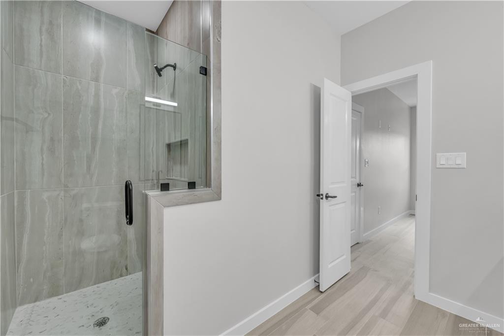 11411 North 24th Lane, Unit B McAllen, TX 78504 - Photo 13 of 24 a bathroom with a shower