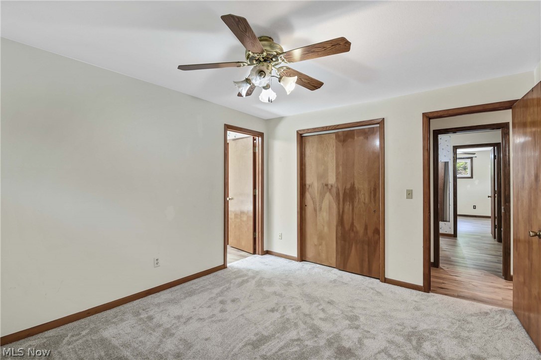 301 Crosse Road Amherst, OH 44001 - Photo 27 of 49 Interior room featuring light gray carpeting, neutral wall finishes, and wood-finish trim and doors