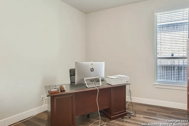 a workspace with furniture and window