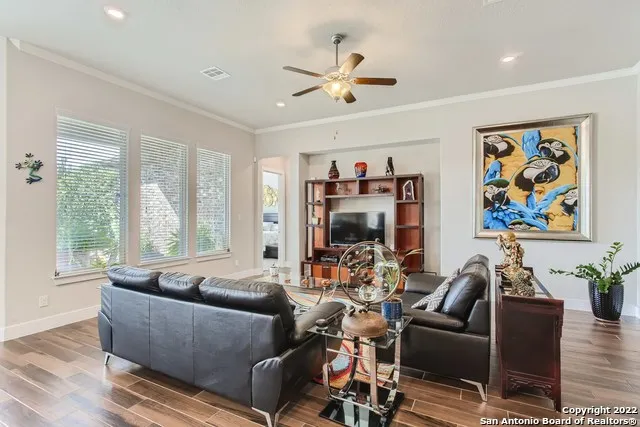 a living room with furniture and a large window