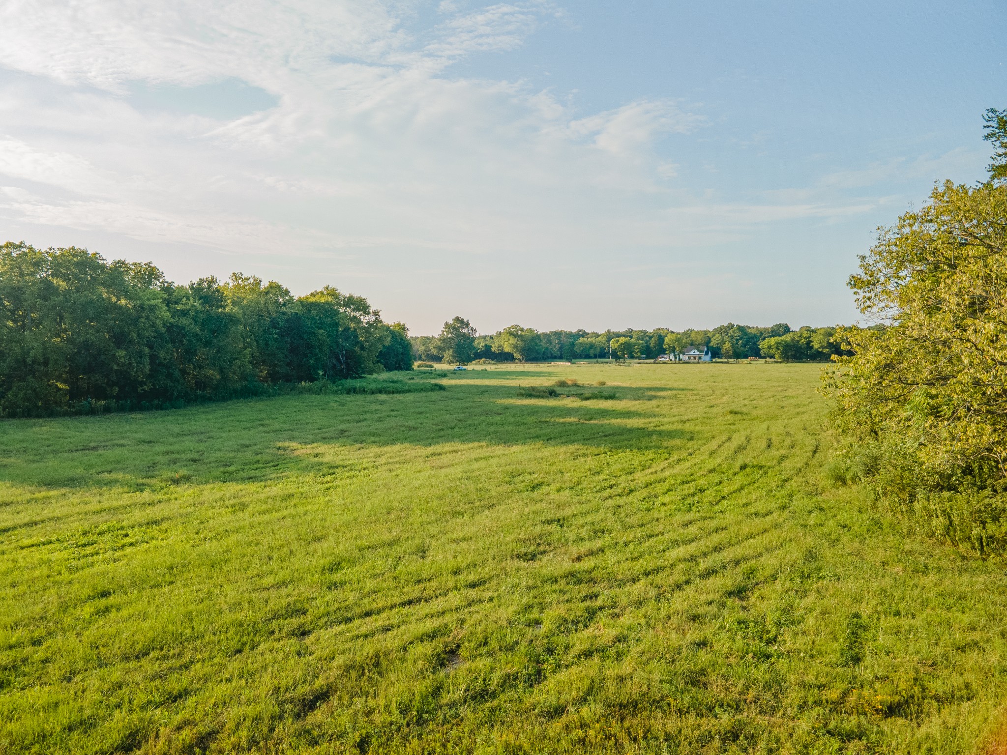 a view of a lake with a big yard