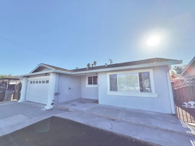 a view of house with yard and front view