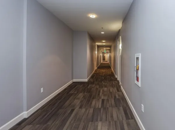 a view of gallery with wooden floor