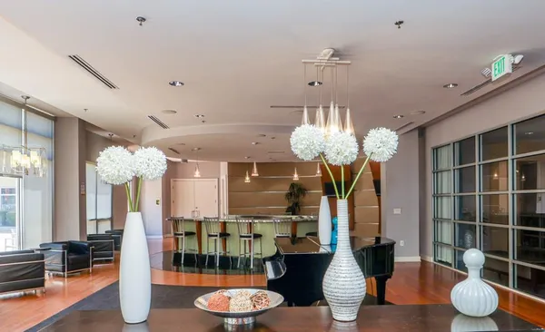 a dining room with furniture and chandelier