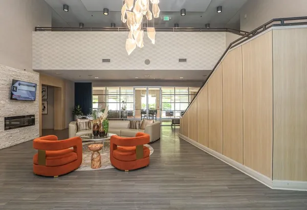 a room with wooden floor and furniture