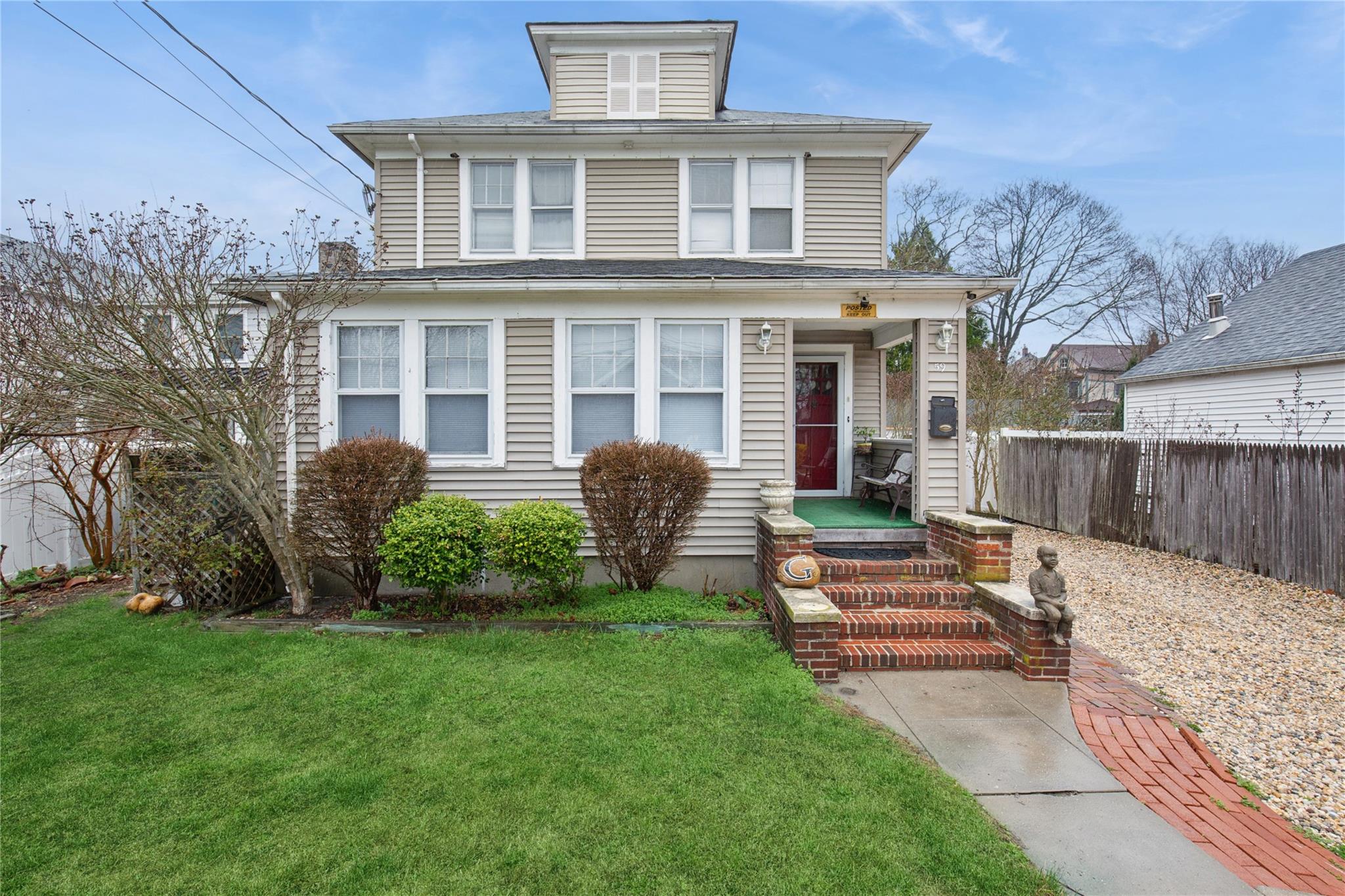 59 Carman Street Patchogue, NY 11772 - Photo 1 of 1 a front view of a house with garden and porch