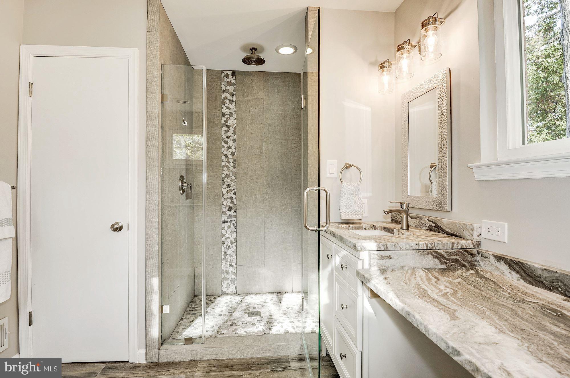 8627 Thames Street Springfield, VA 22151 - Photo 17 of 30 a bathroom with a granite countertop sink mirror and double