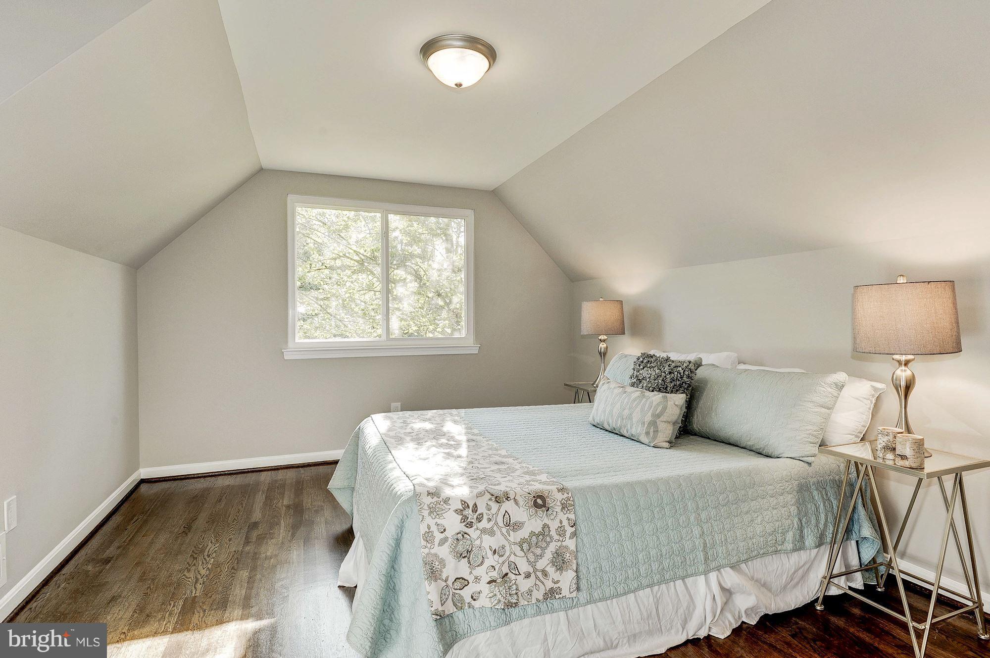 8627 Thames Street Springfield, VA 22151 - Photo 18 of 30 a bedroom with a bed and a window