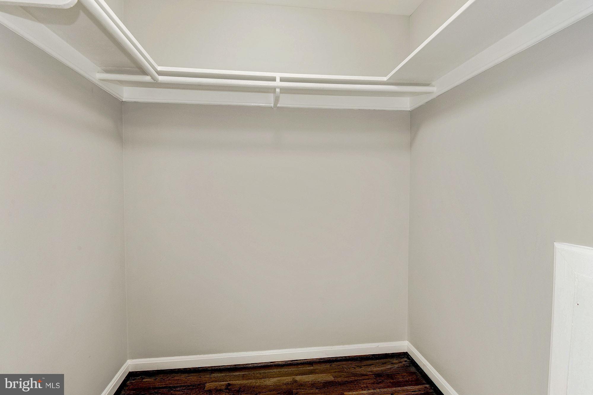 8627 Thames Street Springfield, VA 22151 - Photo 19 of 30 a view of small space with racks on the wall