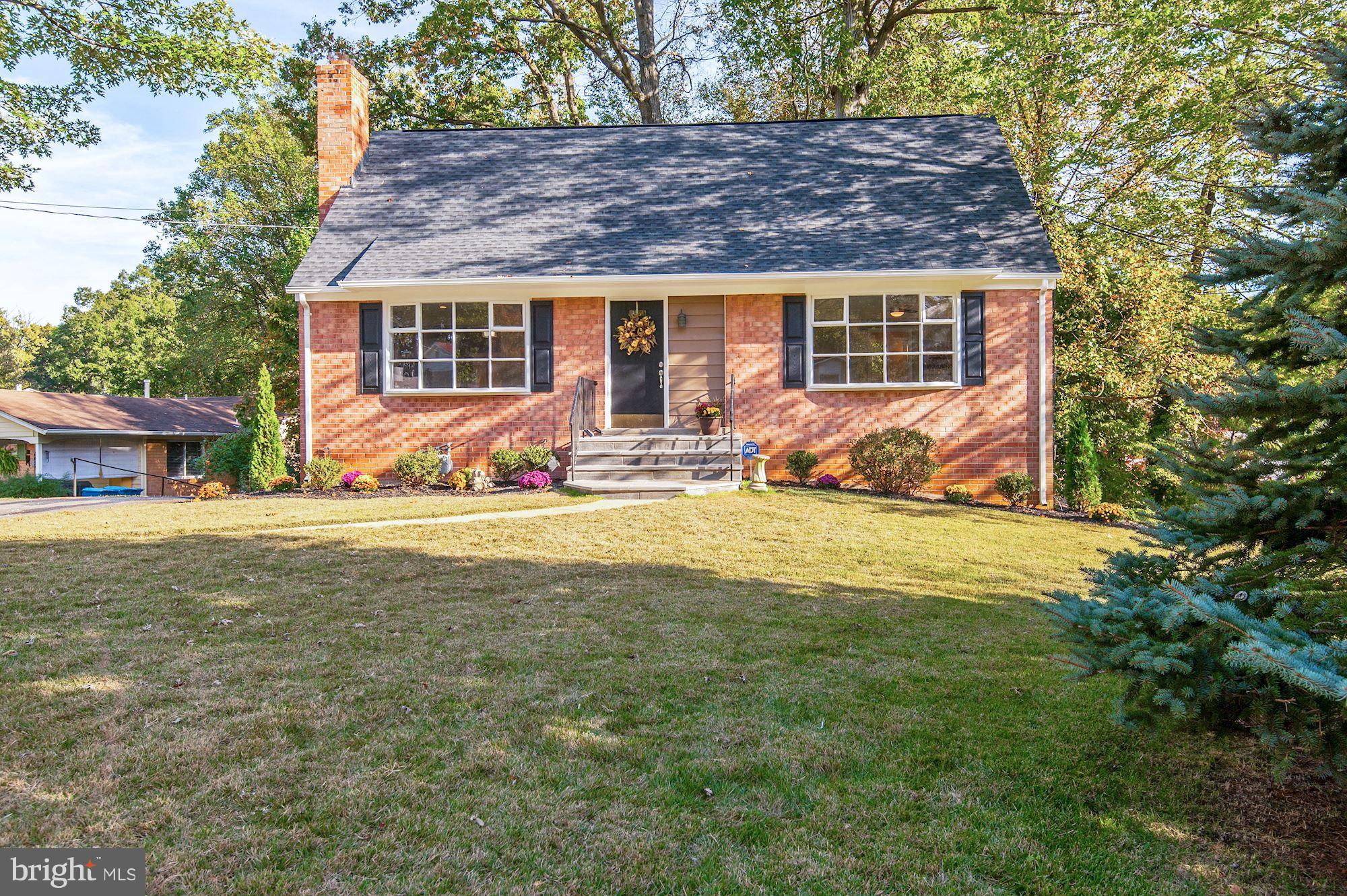8627 Thames Street Springfield, VA 22151 - Photo 3 of 30 a view of a house with a yard