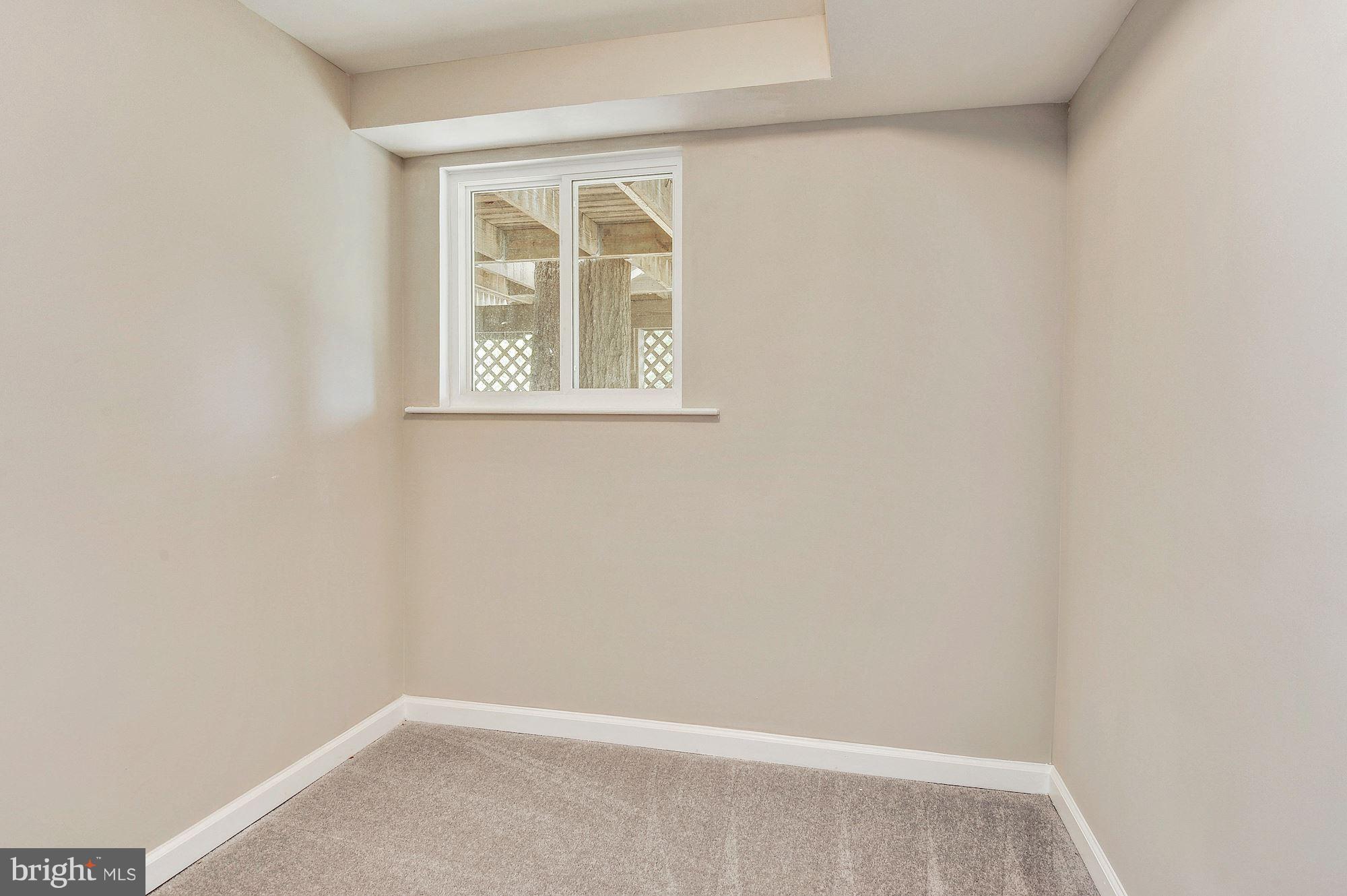 8627 Thames Street Springfield, VA 22151 - Photo 27 of 30 a view of an empty room with a window