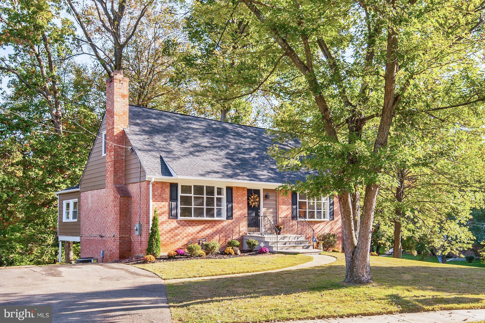 8627 Thames Street Springfield, VA 22151 - Photo 4 of 30 a front view of a house with a yard