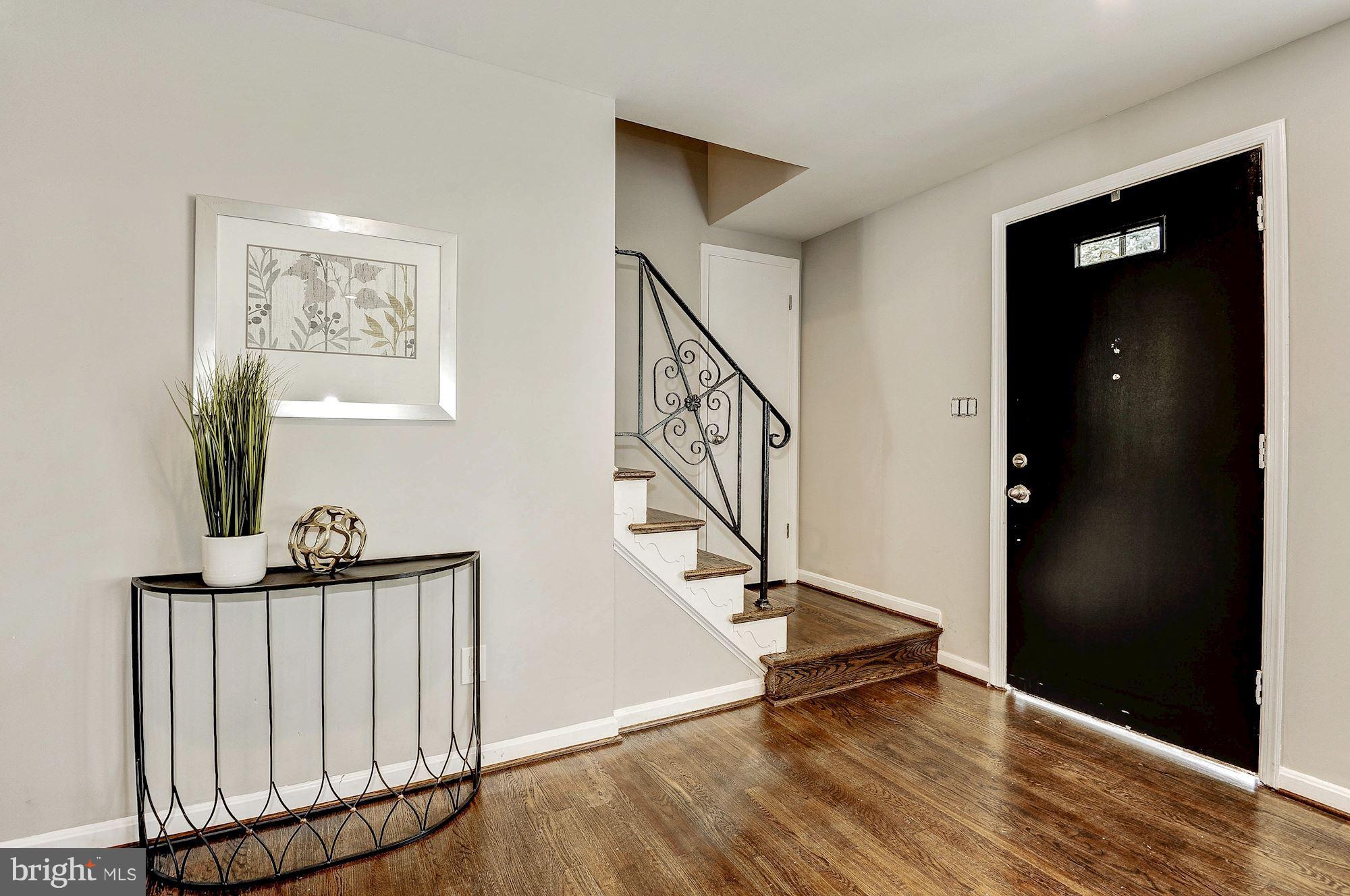 8627 Thames Street Springfield, VA 22151 - Photo 5 of 30 a view of entryway with wooden floor