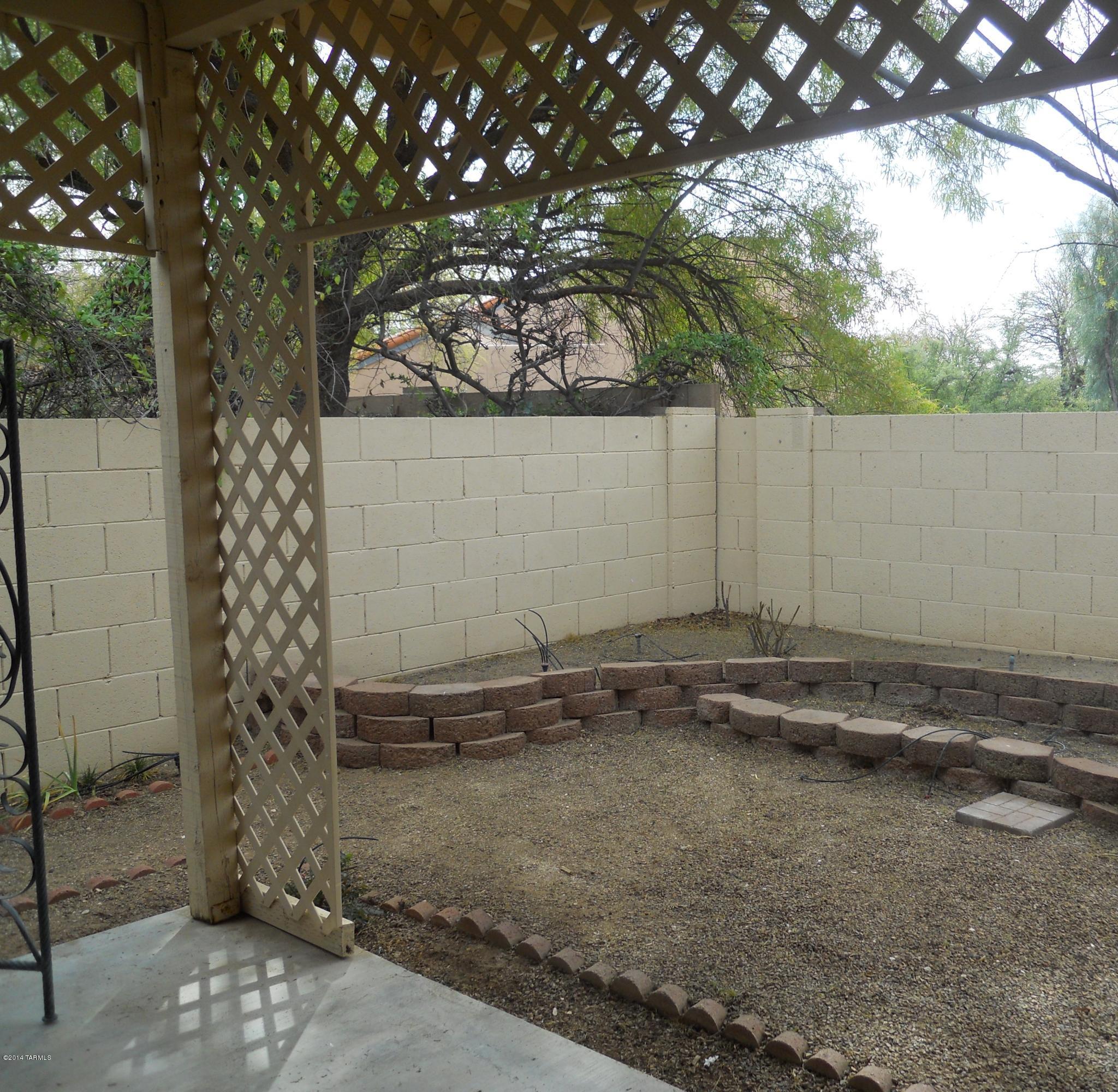 7736 East Elk Creek Road Tucson, AZ 85750 - Photo 8 of 11 a view of a house with a tree