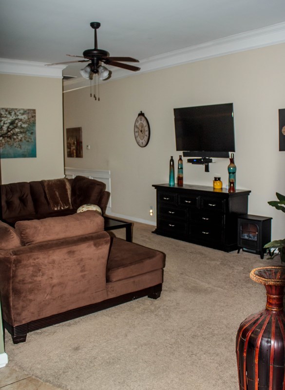 511 Bob White Road Macon, GA 31216 - Photo 11 of 29 a living room with furniture and a flat screen tv