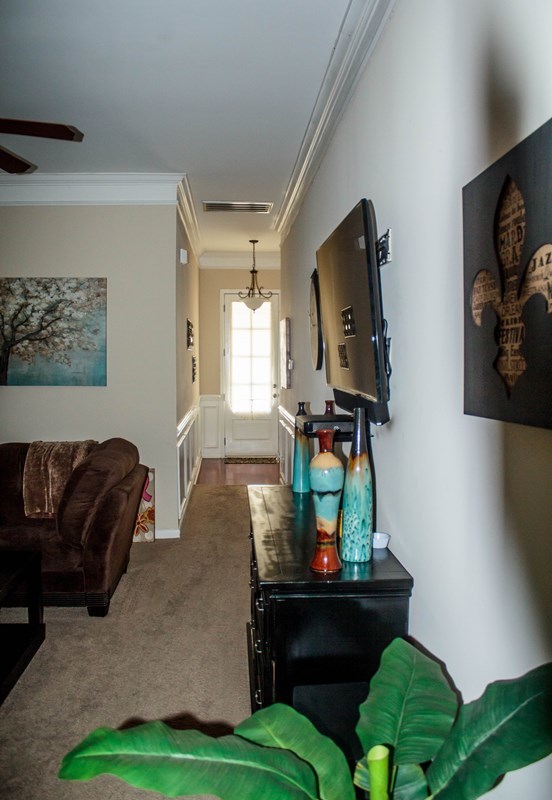 511 Bob White Road Macon, GA 31216 - Photo 12 of 29 a living room with furniture and a flat screen tv