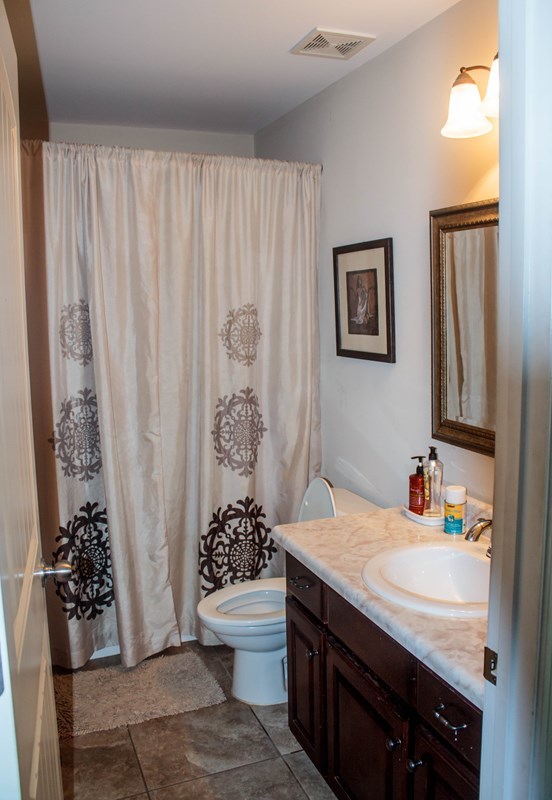 511 Bob White Road Macon, GA 31216 - Photo 15 of 29 a bathroom with a sink toilet and shower