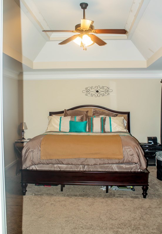 511 Bob White Road Macon, GA 31216 - Photo 18 of 29 a bed sitting in a bedroom next to a window