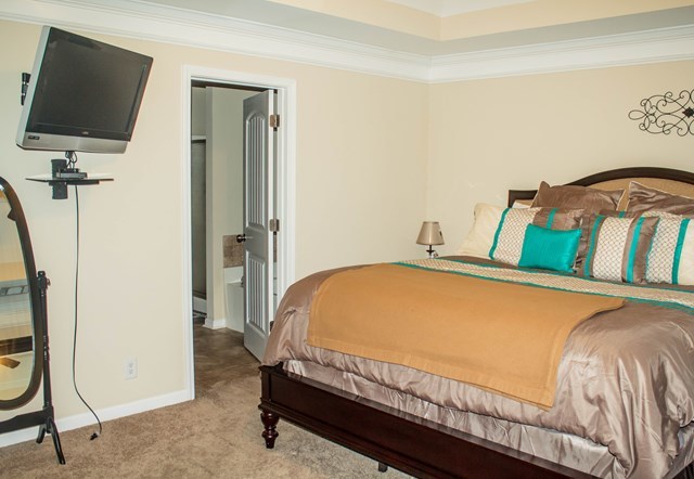 511 Bob White Road Macon, GA 31216 - Photo 19 of 29 a bedroom with a bed and a flat screen tv