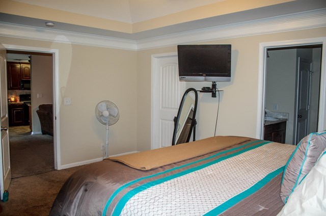 511 Bob White Road Macon, GA 31216 - Photo 24 of 29 a bedroom with a bed and a flat screen tv