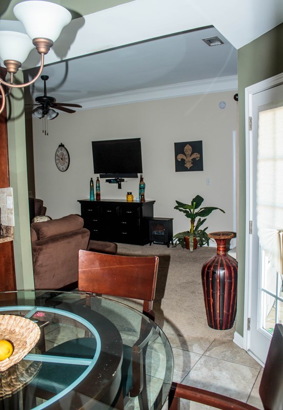 511 Bob White Road Macon, GA 31216 - Photo 10 of 29 a room with furniture a flat screen tv and a window